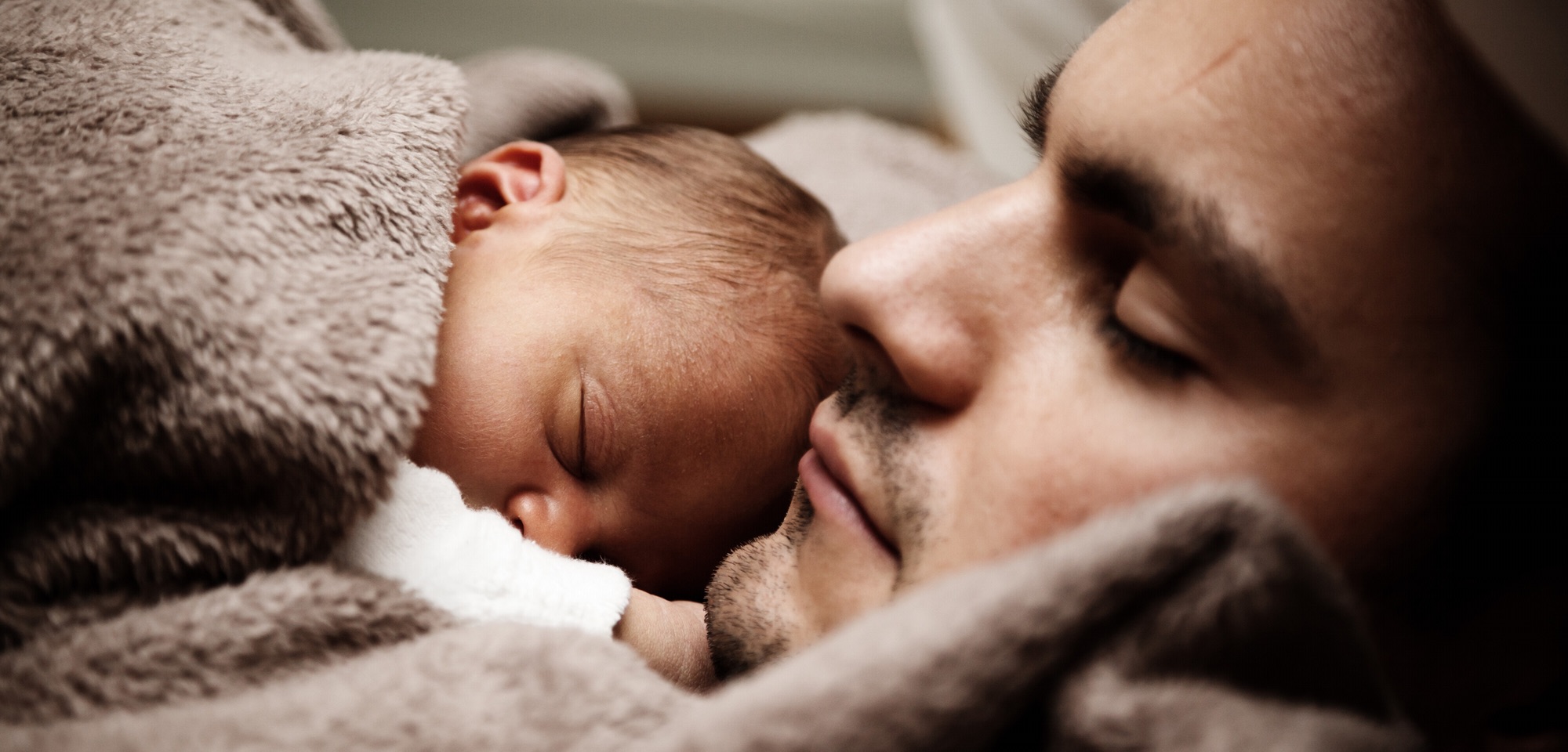 Dad comforting baby.