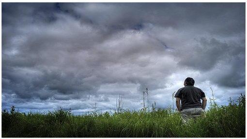Man looking at the clouds.